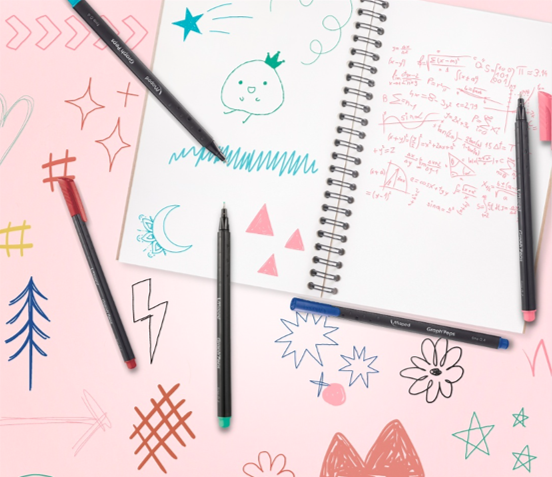 A notebook with doodles on and around the page and fineliners lying on the page