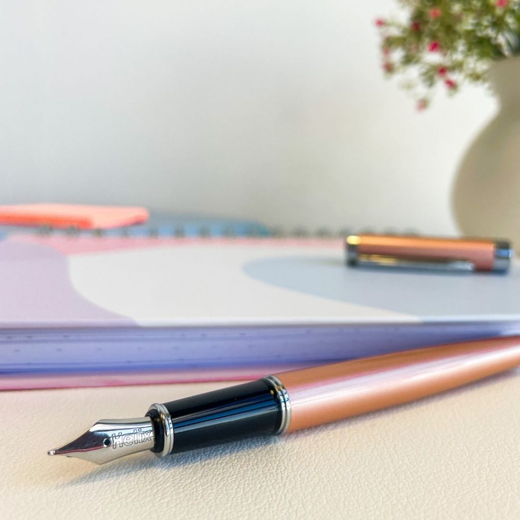 rose gold helix oxford fountain pen on a desk