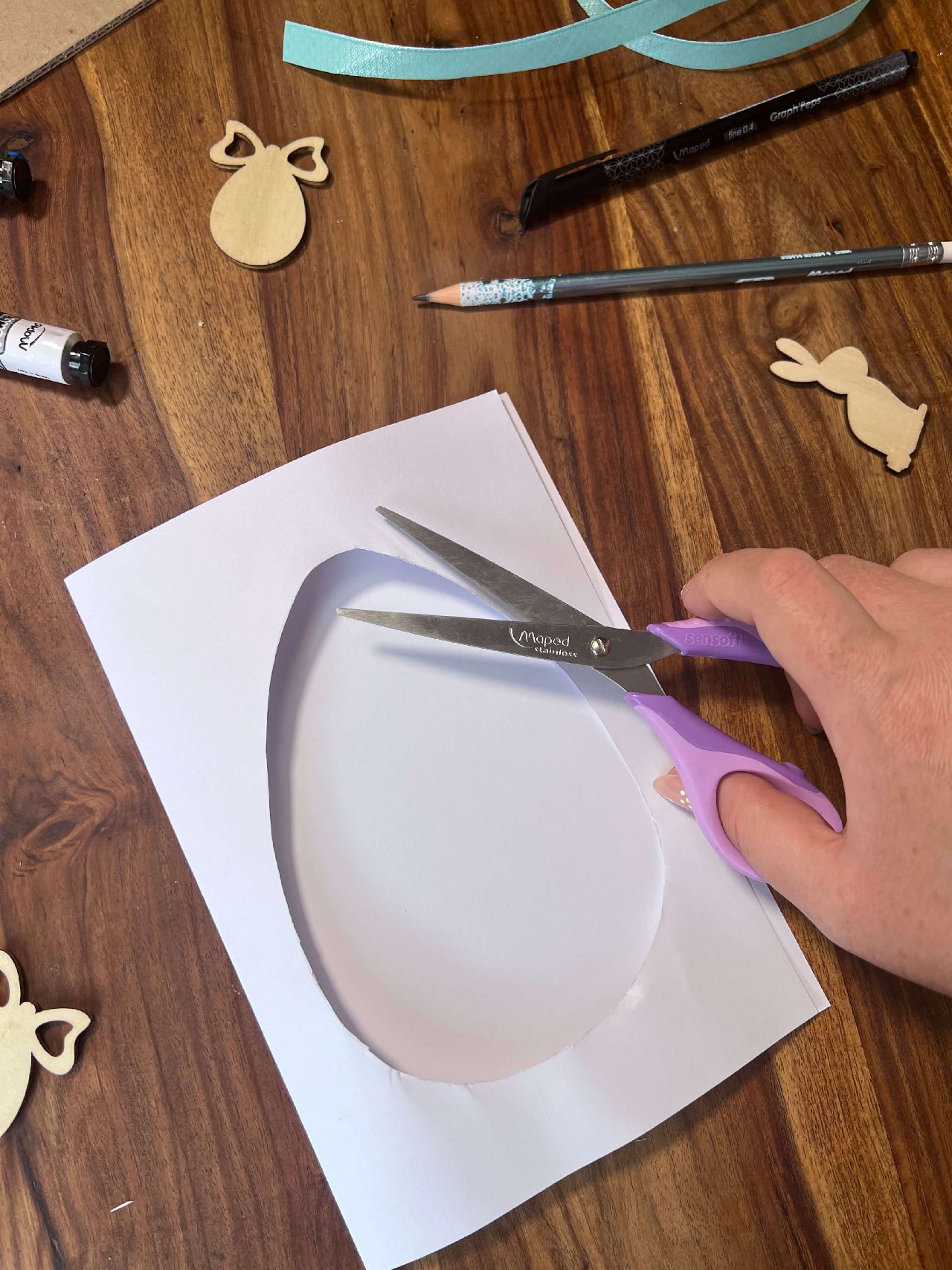Cutting out the egg shape using scissors