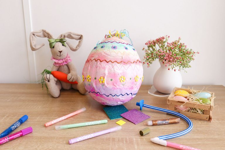 A 3D paper Easter egg decorated with pens, stickers and glitter