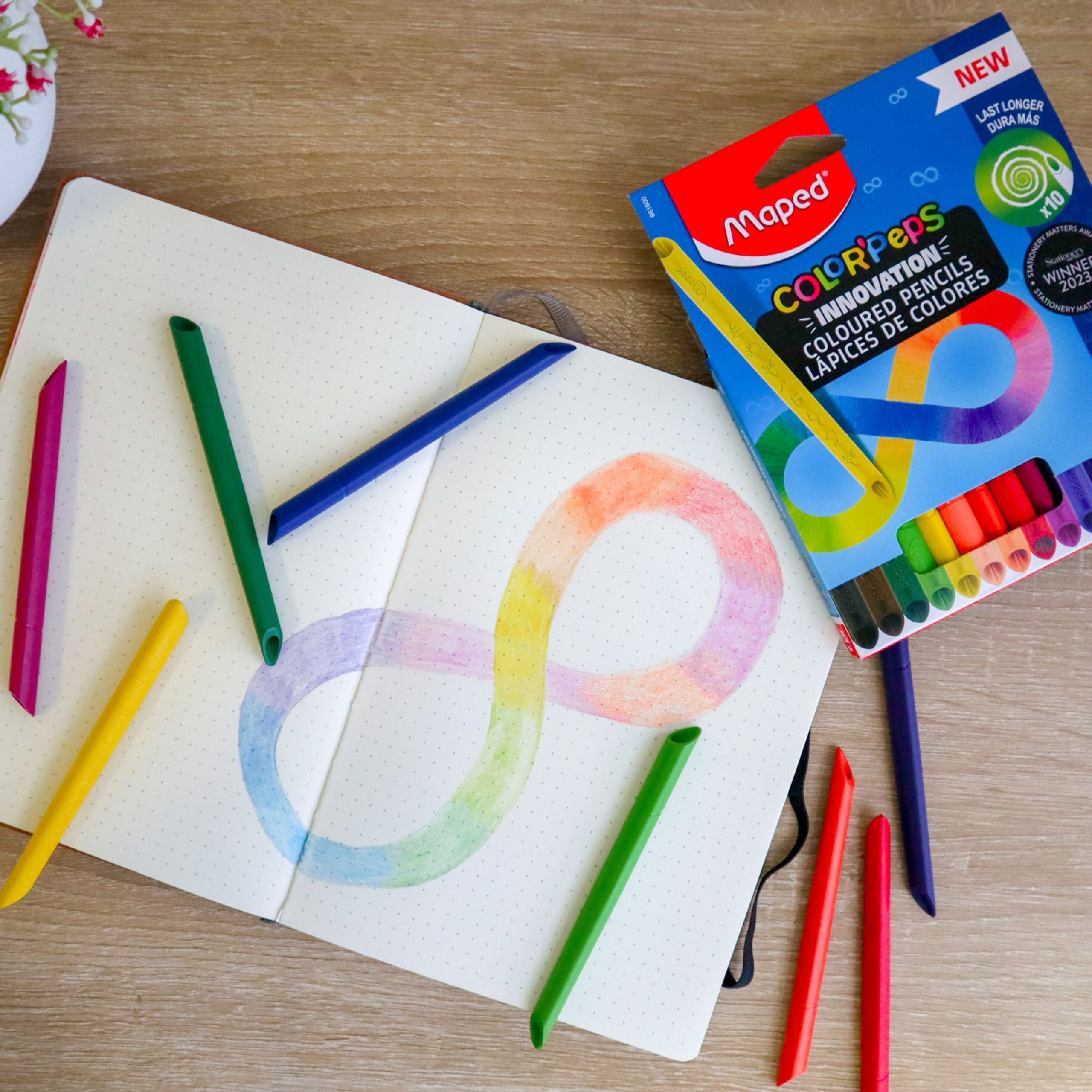 infinity colouring pencils with infinity sign in notebook