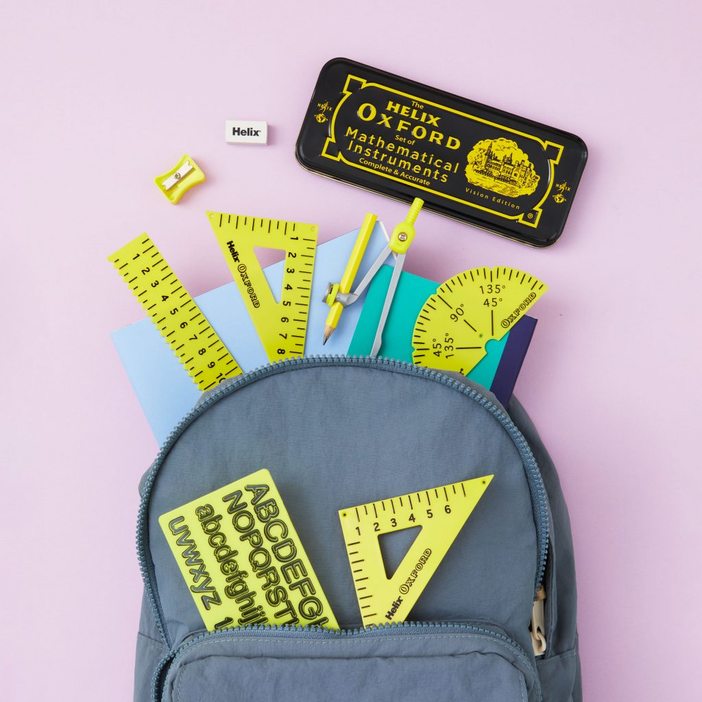 Yellow and black Oxford Vision maths set pictured on a backpack